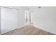 Bright bedroom with wood-look vinyl floors and closet at 8521 N 29Th St, Tampa, FL 33604