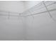 Walk-in closet features white wire shelving for optimal storage and organization at 8521 N 29Th St, Tampa, FL 33604