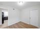 Bright dining room with wood-look vinyl floors and an open kitchen at 8521 N 29Th St, Tampa, FL 33604