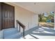 Exterior entryway with freshly painted steps and a modern-style door at 8521 N 29Th St, Tampa, FL 33604