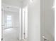 Well lit upstairs hallway provides access to the bedrooms at 8521 N 29Th St, Tampa, FL 33604