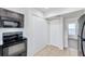 Well-lit kitchen with modern black appliances and a built-in microwave for convenient cooking at 8521 N 29Th St, Tampa, FL 33604