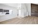 Open-concept living space with modern finishes and a view of the kitchen at 8521 N 29Th St, Tampa, FL 33604
