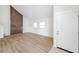 Bright living room featuring hardwood floors and a decorative wall feature at 8521 N 29Th St, Tampa, FL 33604