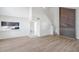 Spacious living room with wood floors, staircase, and open to the kitchen area at 8521 N 29Th St, Tampa, FL 33604
