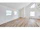 Open-concept living room featuring vaulted ceilings and natural light at 8521 N 29Th St, Tampa, FL 33604