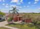 Aerial view of the home featuring mature landscaping and well-manicured lawn at 8601 Chadwick Dr, Tampa, FL 33635