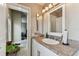 Bathroom featuring granite counters and a view into the bedroom at 8601 Chadwick Dr, Tampa, FL 33635