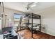 Bedroom with wood floors and a lofted bed setup at 8601 Chadwick Dr, Tampa, FL 33635