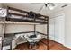 Bedroom boasts wood floors, lofted bed, and accent chair at 8601 Chadwick Dr, Tampa, FL 33635