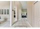 Spacious foyer featuring tile floors with decorative pattern and neutral wall paint at 8601 Chadwick Dr, Tampa, FL 33635