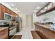 Updated kitchen boasts stainless steel appliances, granite countertops, and ample storage space at 8601 Chadwick Dr, Tampa, FL 33635