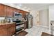 Modern kitchen features stainless steel appliances, granite counters, and mosaic backsplash at 8601 Chadwick Dr, Tampa, FL 33635