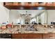 Kitchen features dark cabinetry, granite countertops, and a pass-through overlooking the living area at 8601 Chadwick Dr, Tampa, FL 33635