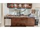 Kitchen pass-through with granite countertops and dark cabinetry at 8601 Chadwick Dr, Tampa, FL 33635