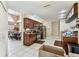 Well-appointed kitchen with dark wood cabinetry, stainless steel appliances, and an adjacent dining area at 8601 Chadwick Dr, Tampa, FL 33635