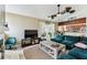 Bright living room with access to the outdoor screened-in patio at 8601 Chadwick Dr, Tampa, FL 33635