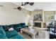 Spacious living room features high ceilings, a ceiling fan, and a cozy fireplace at 8601 Chadwick Dr, Tampa, FL 33635