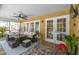 Covered outdoor patio features comfortable seating and access to the pool at 8601 Chadwick Dr, Tampa, FL 33635