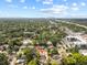 Aerial view of the property, nestled among trees and showcasing proximity to the city at 914 E North St, Tampa, FL 33604
