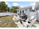 Private backyard oasis with comfortable seating around a modern fire pit, ideal for outdoor entertaining and relaxation at 914 E North St, Tampa, FL 33604