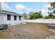 The backyard features a white fence, lawn area, and space for outdoor activities or landscaping at 914 E North St, Tampa, FL 33604