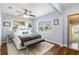 Bright bedroom with lots of natural light, stylish accents, and wood floors at 914 E North St, Tampa, FL 33604