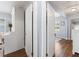 Open view of bedroom featuring desk, dual closets, and wood floors at 914 E North St, Tampa, FL 33604