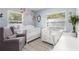 Charming Bedroom featuring chair, bassinet, windows, and wood floors at 914 E North St, Tampa, FL 33604