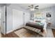 Comfortable bedroom featuring ample natural light, ceiling fan, and ensuite closets at 914 E North St, Tampa, FL 33604