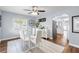 Bright dining room showcasing a modern table, stylish chairs, and a glimpse into the kitchen at 914 E North St, Tampa, FL 33604