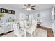 Chic dining room featuring a glass table, white chairs, and elegant decor at 914 E North St, Tampa, FL 33604
