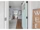 Bright entryway showcasing hardwood floors and views into the dining room and kitchen at 914 E North St, Tampa, FL 33604