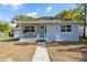 Charming single-story home featuring a welcoming front porch and well-maintained landscaping at 914 E North St, Tampa, FL 33604