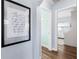 Hallway leading to bedrooms with wood floors and modern decor at 914 E North St, Tampa, FL 33604