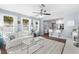 Bright living room with kitchen access featuring natural light, modern furnishings, and a cozy atmosphere at 914 E North St, Tampa, FL 33604