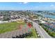 Aerial view showcasing the location of the complex with nearby tennis courts and easy access to local amenities at 9201 Captiva Cir, St Pete Beach, FL 33706
