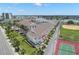 Scenic view of waterfront property featuring a marina, baseball field, and tennis courts at 9201 Captiva Cir, St Pete Beach, FL 33706
