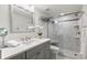 Updated bathroom features a walk-in shower and modern vanity at 9201 Captiva Cir, St Pete Beach, FL 33706