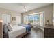 Cozy bedroom with a large window and tile floors at 9201 Captiva Cir, St Pete Beach, FL 33706