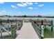 Scenic pier offers waterfront access, perfect for leisurely strolls and enjoying waterfront views at 9201 Captiva Cir, St Pete Beach, FL 33706