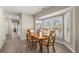 Sunlit dining room with bright windows and modern lighting at 9201 Captiva Cir, St Pete Beach, FL 33706