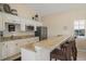 Well-equipped kitchenette with granite countertops, modern appliances, and bar seating, perfect for entertaining guests in the clubhouse at 9201 Captiva Cir, St Pete Beach, FL 33706