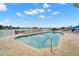 Relaxing community pool area with lounge chairs, perfect for enjoying the waterfront views and sunny Florida weather at 9201 Captiva Cir, St Pete Beach, FL 33706