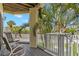 Screened porch has chairs and views of the community at 9201 Captiva Cir, St Pete Beach, FL 33706