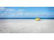 Secluded sandy beach with clear blue waters, offering a tranquil escape at 9201 Captiva Cir, St Pete Beach, FL 33706