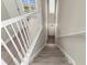 Elegant stairway with modern finishes, leading to the upper level of this beautiful home at 9201 Captiva Cir, St Pete Beach, FL 33706