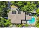Aerial view of the home's roof, solar panels, backyard pool, and mature landscaping at 925 Monticello N Blvd, St Petersburg, FL 33703
