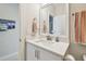 Bathroom featuring a vanity with a quartz countertop, a mirror, and modern fixtures at 925 Monticello N Blvd, St Petersburg, FL 33703