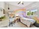 Bright bedroom featuring a pastel rainbow mural, modern furnishings, and lots of natural light at 925 Monticello N Blvd, St Petersburg, FL 33703